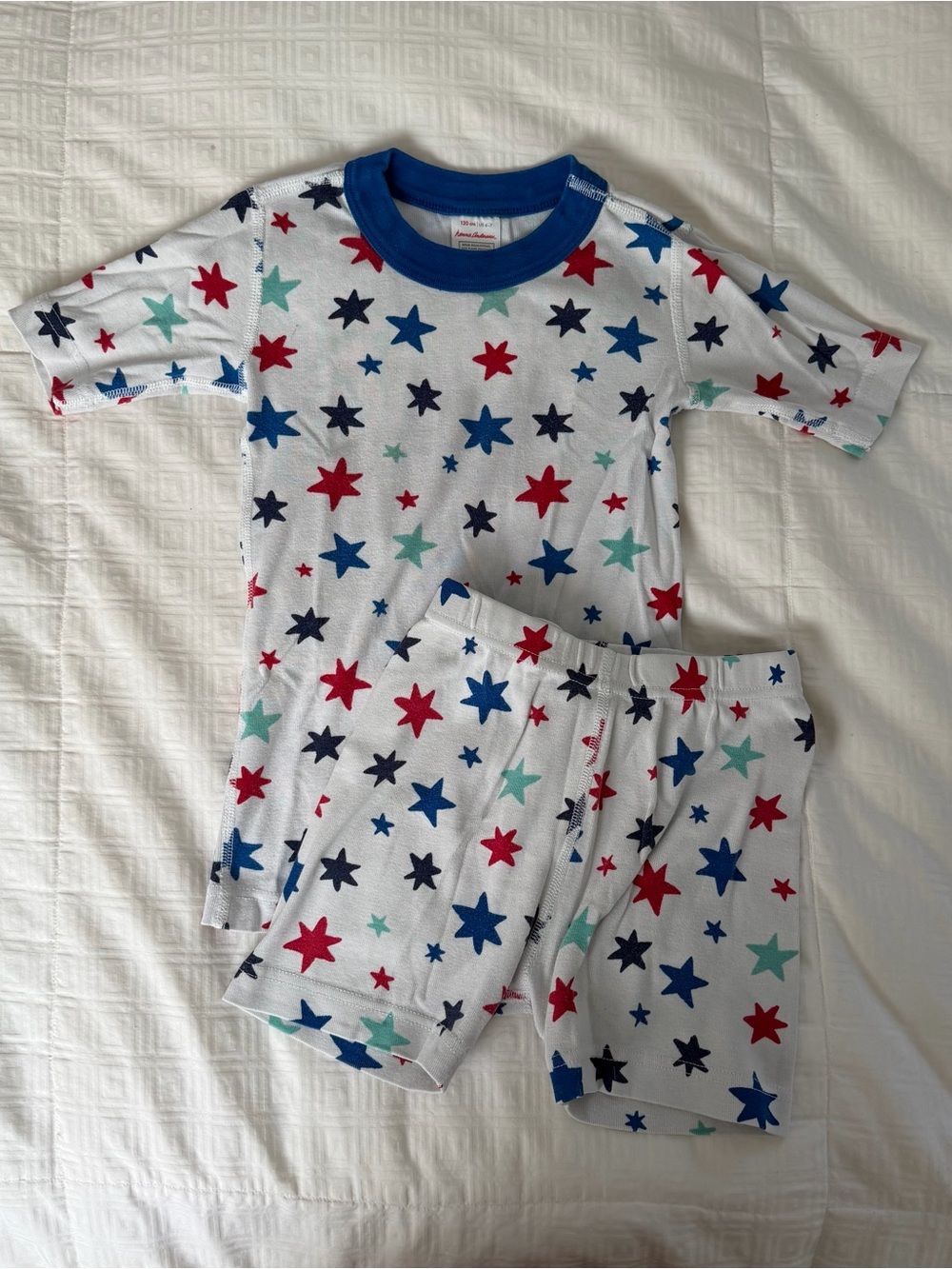 Hanna Andersson White Pajama Set with Blue Collar & Red, Navy, Teal Stars